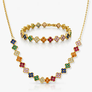 Gold necklace with colorful floral designs on a white background