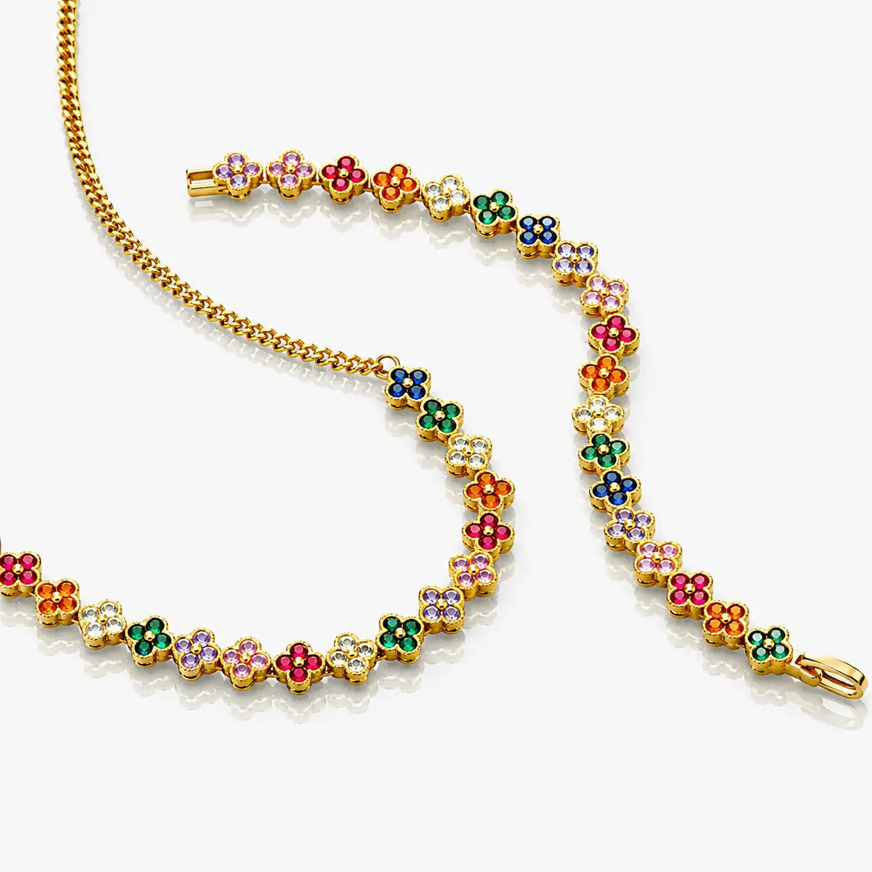 Colorful floral bracelet with gold chain on a white background