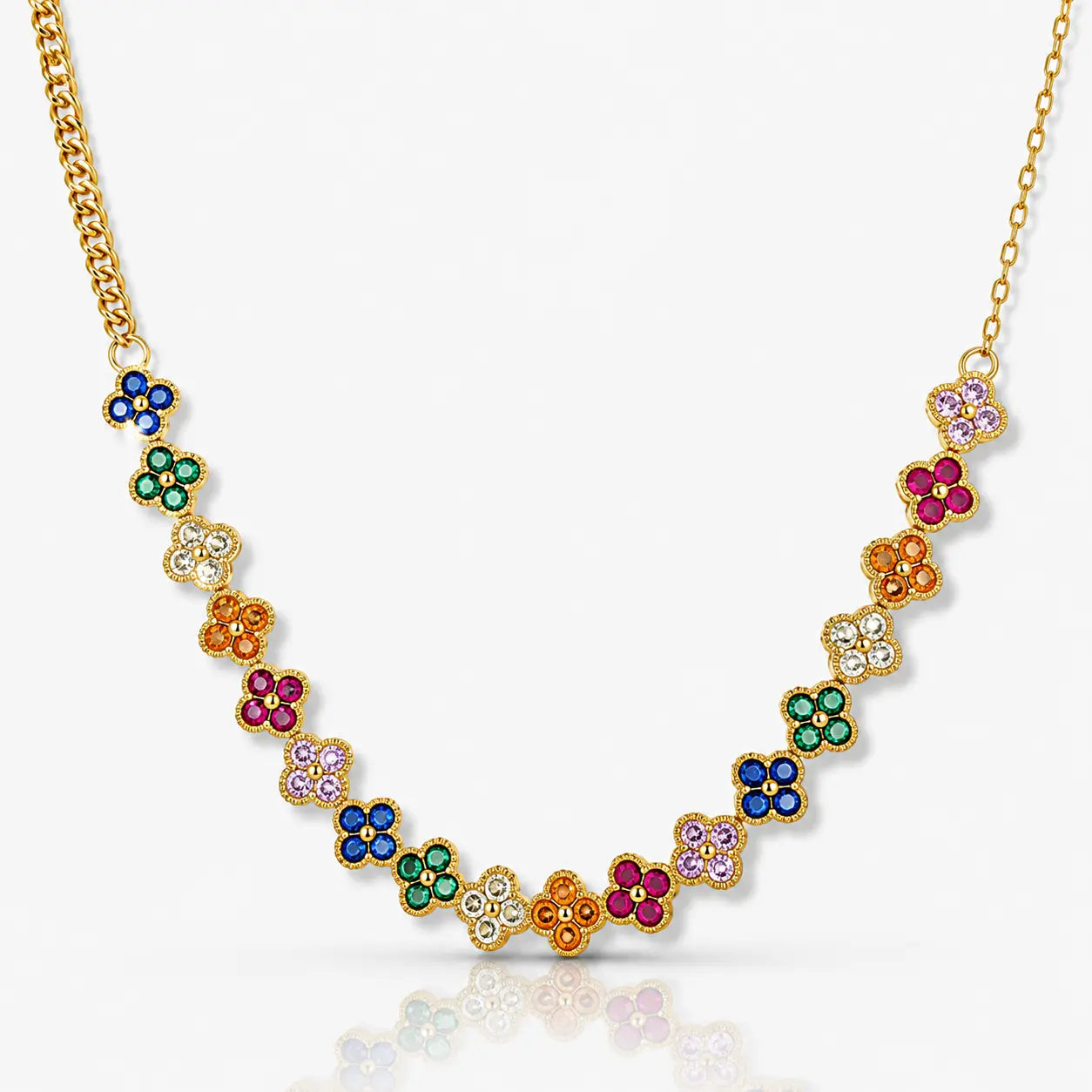 Gold necklace with colorful gemstone flowers on a white background