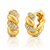 A pair of gold huggie hoop earrings with pavé diamond accents, shown from both the front and side angles on a reflective white surface. The side view shows a 'S925' sterling silver mark on the inside.
