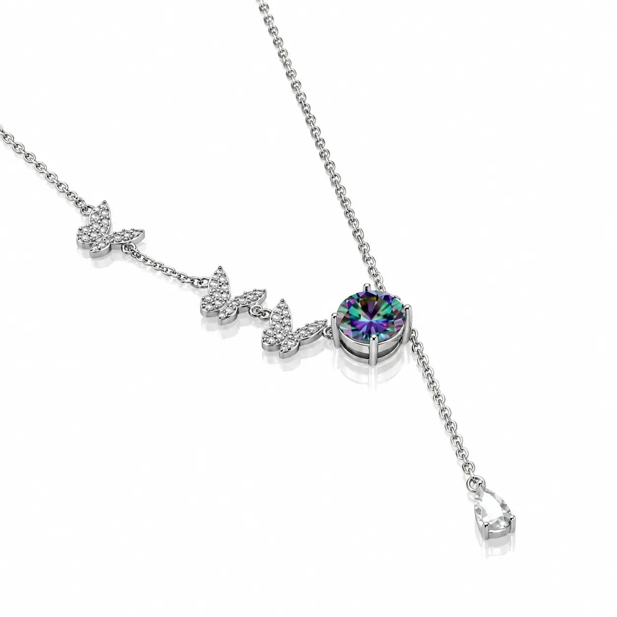 A silver Y-shaped necklace featuring three butterfly charms lined with small clear crystals, leading to a round bezel-set iridescent purple gemstone, shown on a white background.