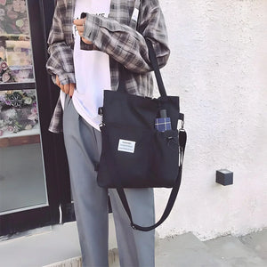 Canvas tote bag with front pocket, top handle, and adjustable crossbody strap – Canvas Pocket Tote by Jewellar