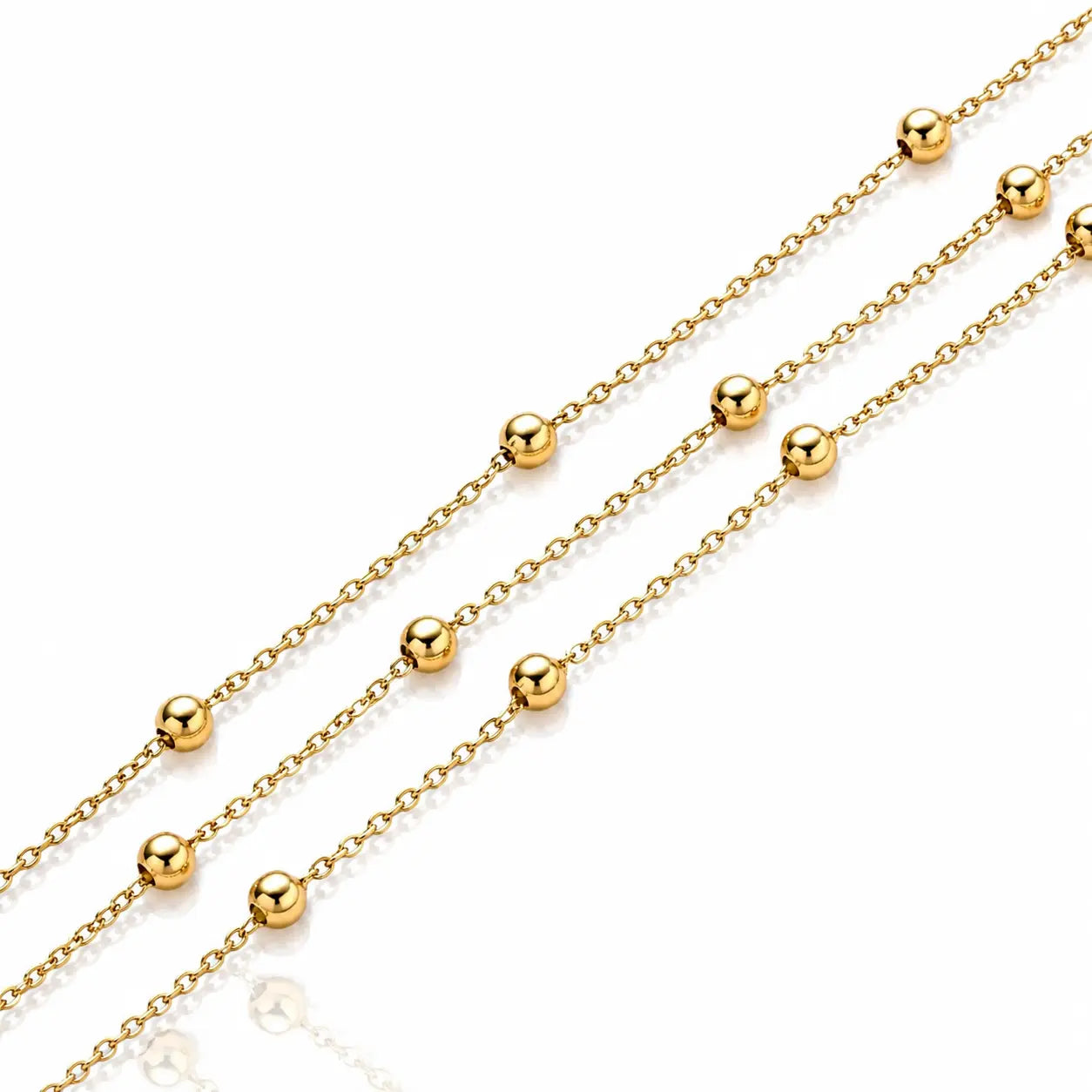 Gold chain necklace with evenly spaced round bead links, shown diagonally on a clean white background.
