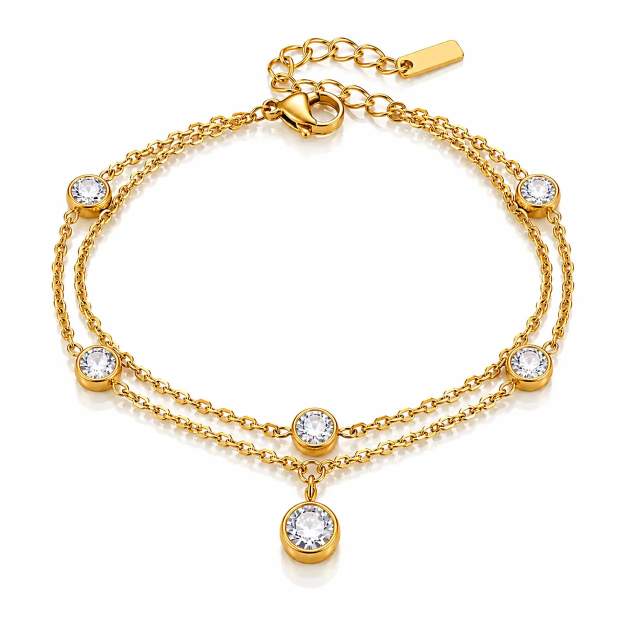 A gold double-strand chain bracelet with five bezel-set clear round stones and a dangling round stone charm, shown on a clean white background.
