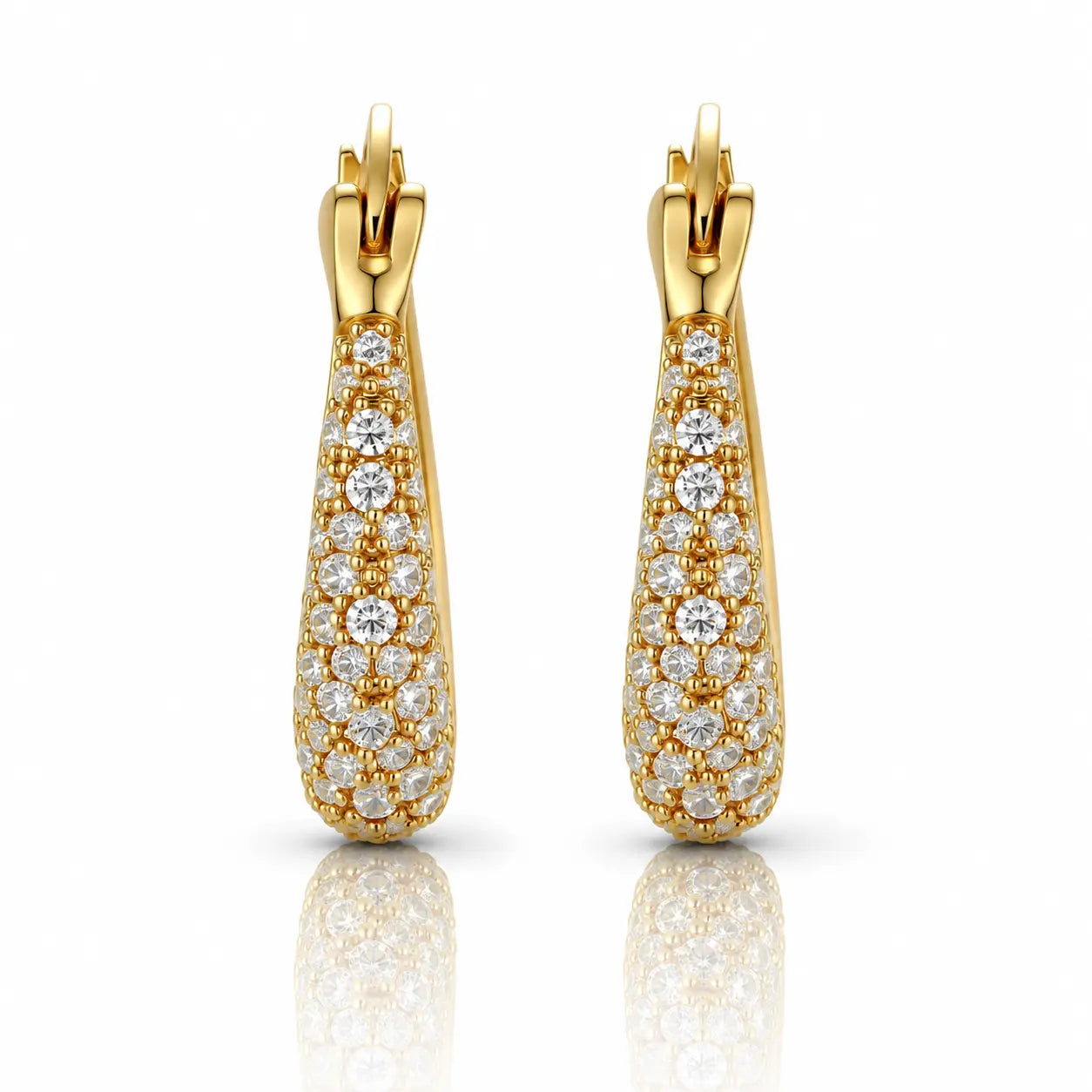 Gold earrings with diamond accents on a white background