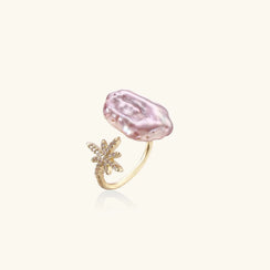 Gold ring with a pink gemstone on a white background