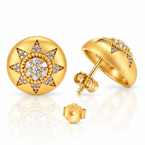 Gold starburst stud earrings with clear gemstones, shown from multiple angles including front, side profile, and back with butterfly clasp on a white reflective background.