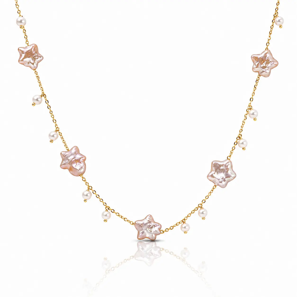 A delicate gold chain necklace featuring five pale pink star-shaped charms and small white pearl beads, displayed on a clean white background with a soft reflection.