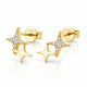 A pair of gold star-shaped stud earrings with clear cubic zirconia accents, shown on a clean white background with a soft reflection. The back of one earring is visible, showing a '925' sterling silver mark on the post.