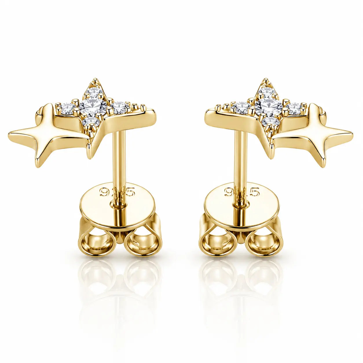 A pair of gold star-shaped stud earrings with clear gemstones, displayed on a clean white background with a soft reflection.