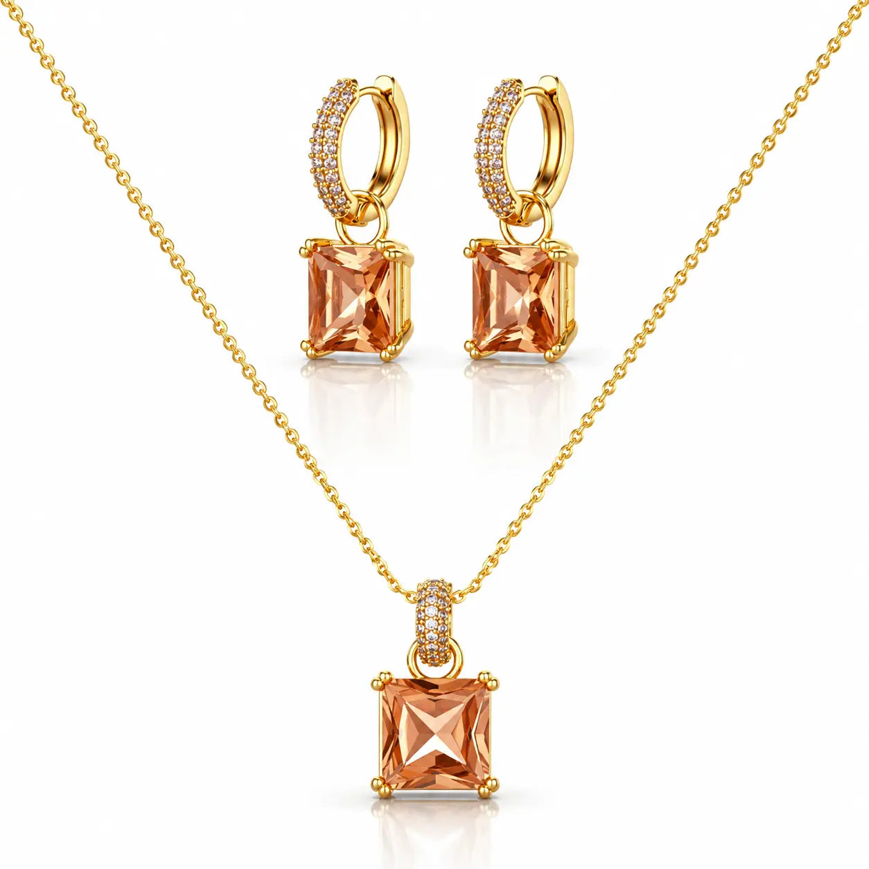 Gold jewelry set featuring a necklace and matching hoop earrings with square peach-colored gemstones and small clear accent stones, displayed on a clean white background.