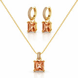 Gold jewelry set featuring a necklace and matching hoop earrings with square peach-colored gemstones and small clear accent stones, displayed on a clean white background.