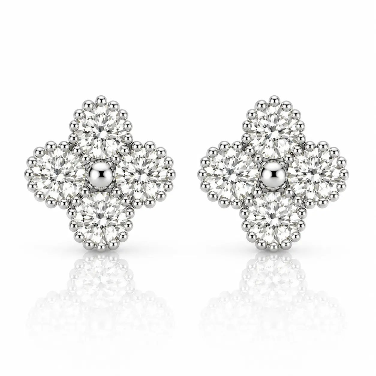 A pair of silver-toned diamond stud earrings in a floral clover design, featuring a central round diamond surrounded by four clusters of smaller diamonds, set against a white background with a soft reflection.
