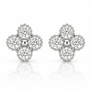 A pair of silver-toned diamond stud earrings in a floral clover design, featuring a central round diamond surrounded by four clusters of smaller diamonds, set against a white background with a soft reflection.