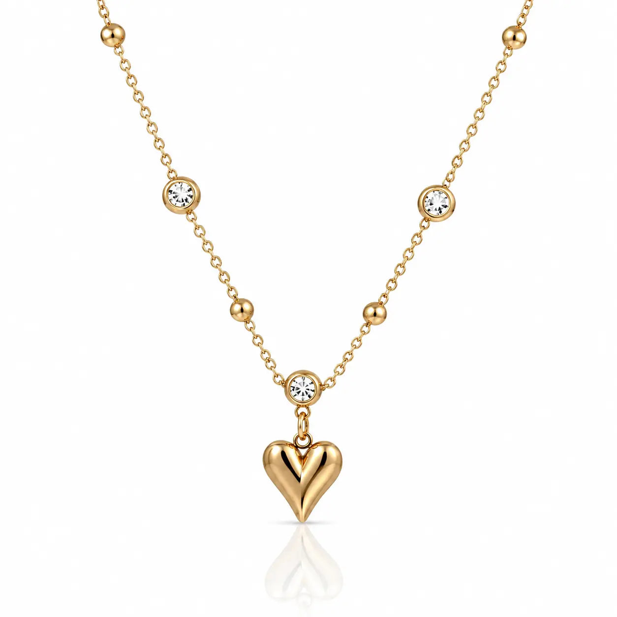 Gold necklace with a heart pendant on a white background