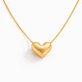 Gold heart-shaped pendant on a white background