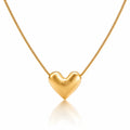 Gold heart-shaped pendant on a chain against a white background