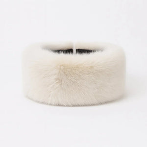 Warm woolen winter hat with fluffy fur pom-pom in soft pastel and classic colors – perfect for autumn and winter.