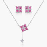 Jewelry set with pink gemstone necklace and earrings on a white background