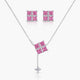 Jewelry set with pink gemstone necklace and earrings on a white background