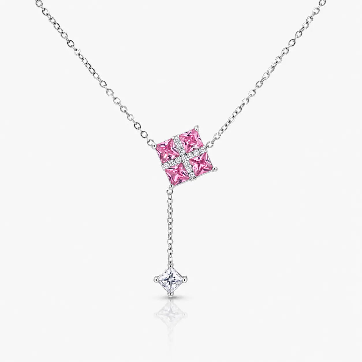 Necklace with a pink gemstone pendant on a white background