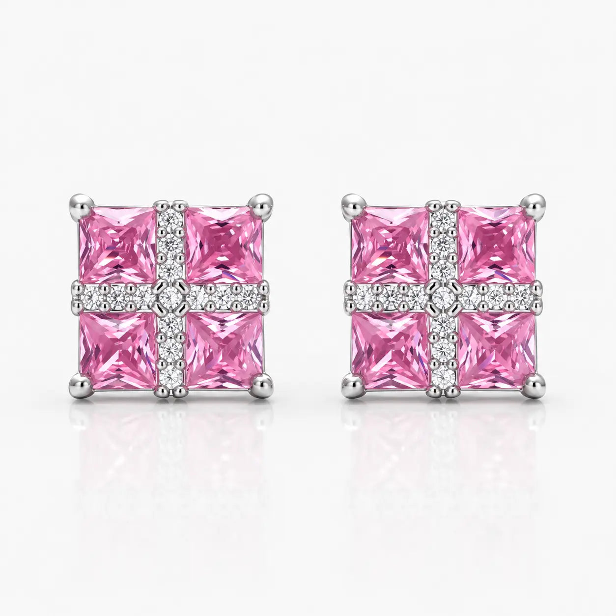 Pair of pink square gemstone earrings with silver accents on a white background