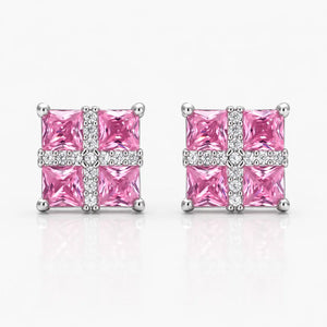 Pair of pink square gemstone earrings with silver accents on a white background