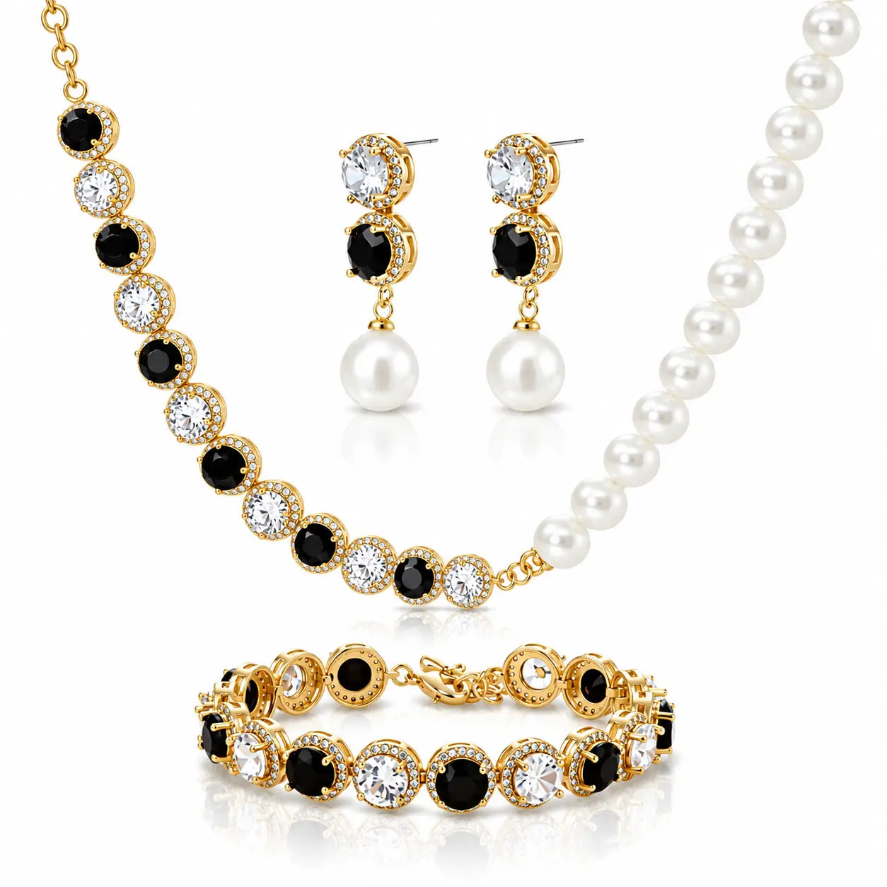 A gold-plated jewelry set featuring a pearl and black crystal necklace, matching drop earrings, and a bracelet, displayed on a clean white background.