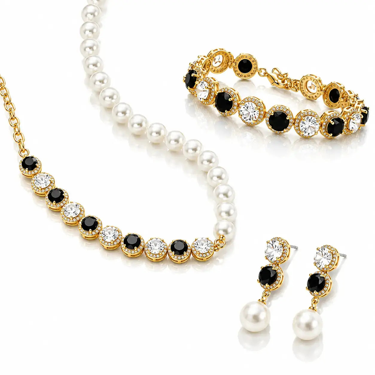 A gold and pearl jewelry set on a white background, including a necklace, bracelet, and matching earrings. The pieces feature white pearls, gold-plated settings, and alternating round black and clear crystal accents.