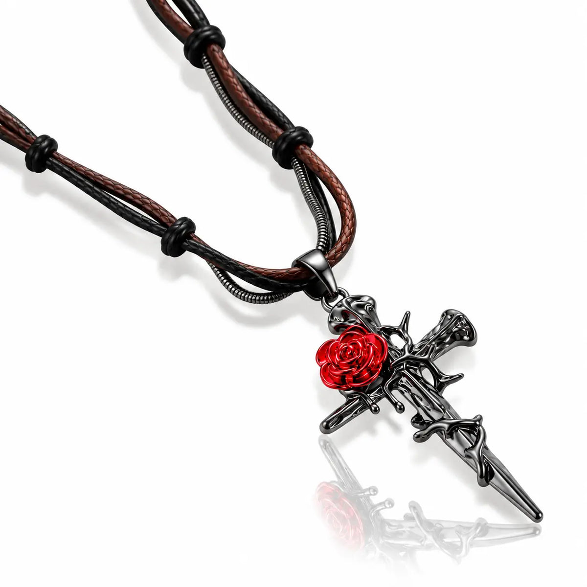 A gothic-style pendant necklace featuring a black metal dagger with a red rose detail, suspended on a braided brown and black cord chain against a white background.