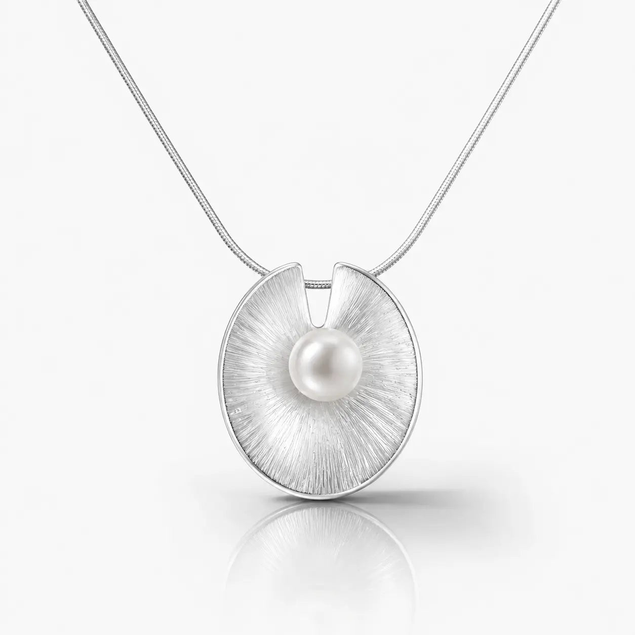 Silver pendant with a pearl on a white background