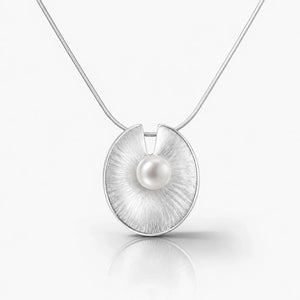 Silver pendant with a pearl on a white background