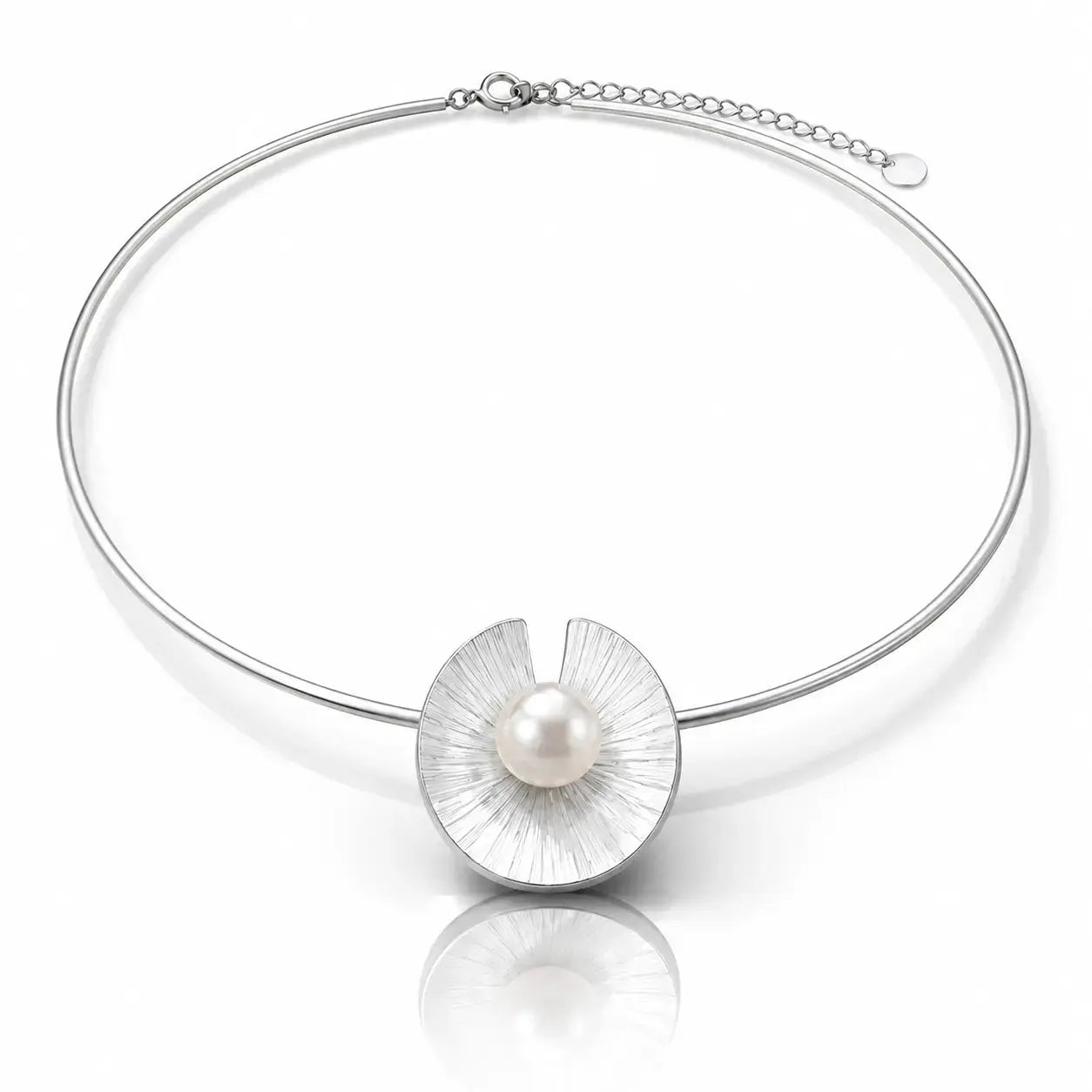 A silver-toned bangle necklace featuring a textured, petal-like circular pendant with a single white pearl at its center, displayed on a clean white background with a soft reflection.