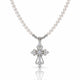 A silver cross pendant necklace with a strand of white pearls, featuring clear gemstones set into the cross and along the chain, shown on a white background with a soft reflection below.