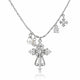 Silver-tone cross pendant necklace with clear rhinestones, a pearl charm, and snowflake charms on a white background.