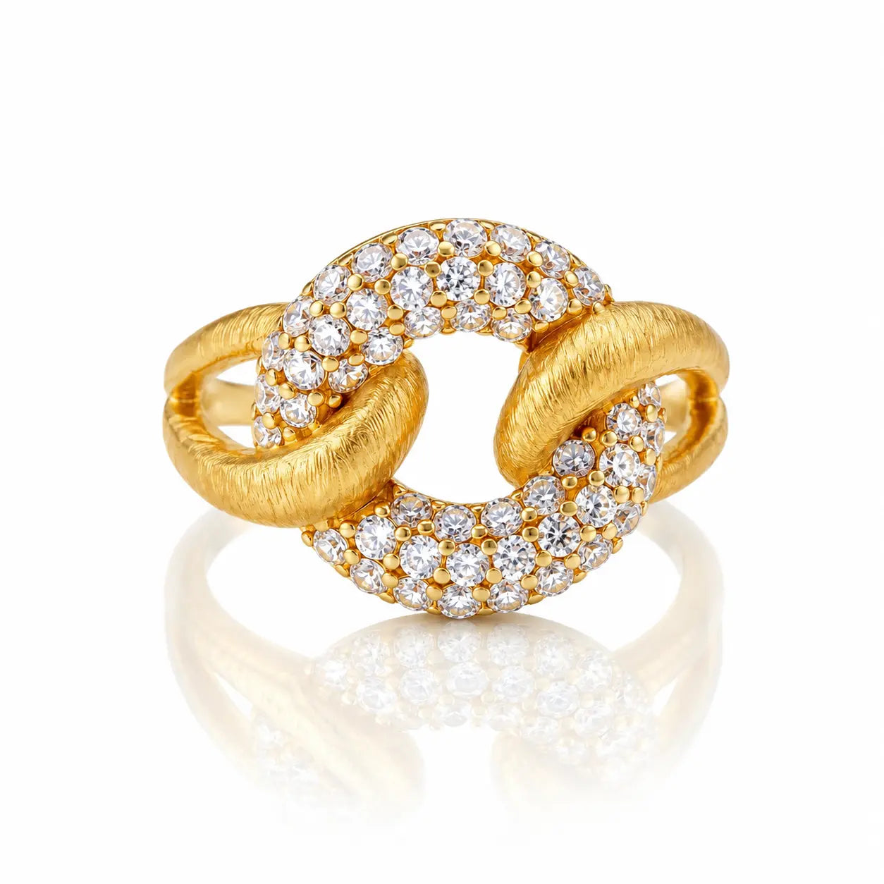 A gold ring with a knotted, interlocking design, featuring pavé-set round diamonds on the top and bottom curves. The ring is photographed on a clean white background with a soft reflection underneath.