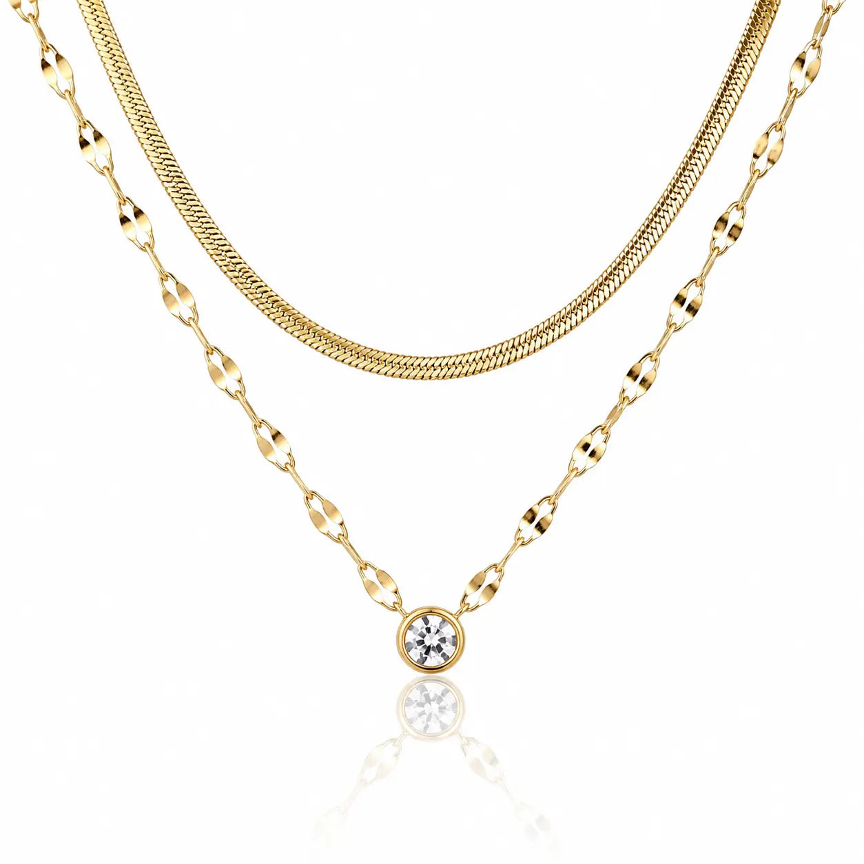 Three gold necklaces with different chains on a white background