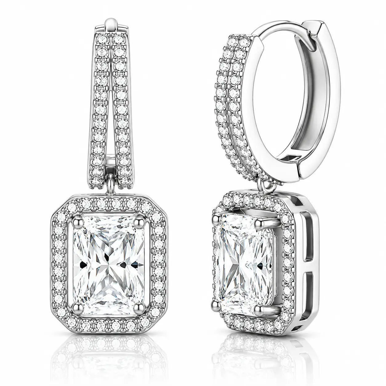 A pair of silver-toned huggie hoop earrings with rectangular princess-cut diamond drops, surrounded by halo and channel settings of small round diamonds, shown on a white background with a subtle reflection.