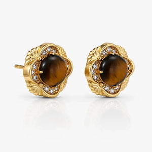 Gold earrings with tiger's eye stones on a white background