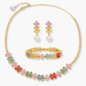 Gold jewelry set with colorful floral necklace, matching bracelet, and pearl drop earrings