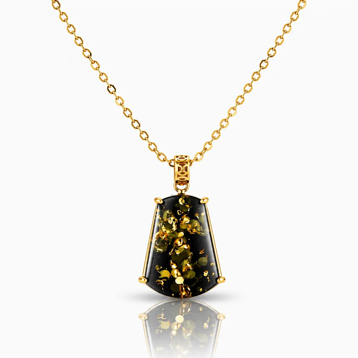 Gold necklace with a black pendant on a white background