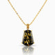 Gold necklace with a black pendant on a white background