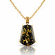 A gold pendant necklace featuring a faceted shield-shaped black stone with shimmering gold inclusions, suspended from a delicate gold chain on a white background with a soft reflection.