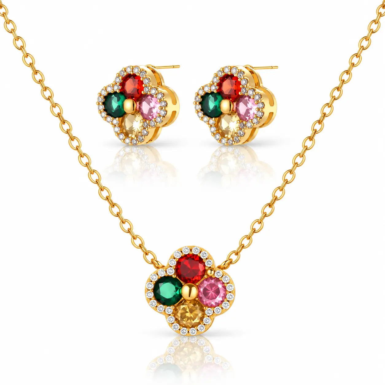 Gold-tone necklace and matching stud earrings set with four flower-shaped clusters of colored gemstones and small clear accent stones, shown on a white background with reflections.