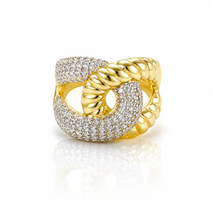 A gold ring with a twisted rope texture on one band and a pavé-set diamond-encrusted band, shown on a white reflective background.
