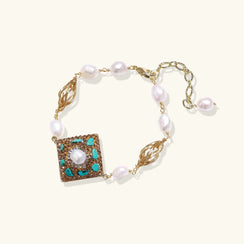 Jewelry bracelet with pearls and decorative square element on a white background