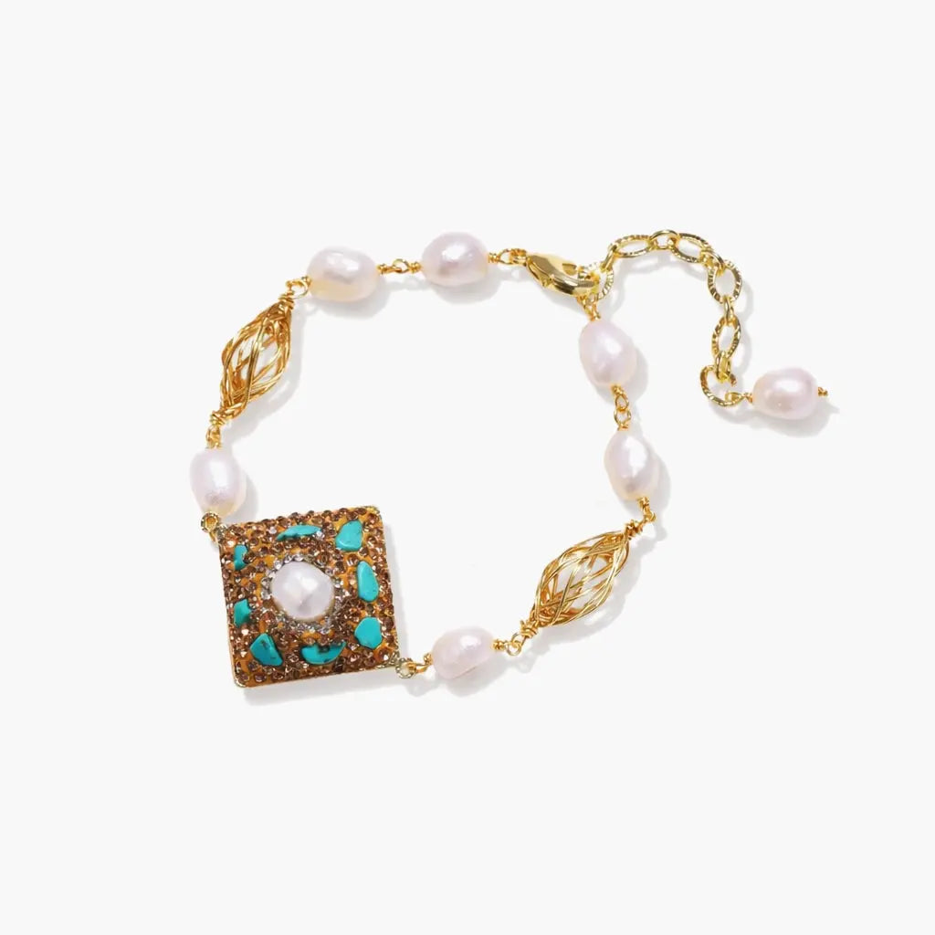 14K gold pearl bracelet with turquoise accents, ornate square charm, and gold chain.