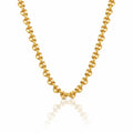 A gold chain necklace with a textured, knotted link design, displayed on a clean white background with a soft reflection below.