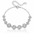A silver-tone chain bracelet featuring seven heart-shaped settings, each adorned with clear stones, displayed on a clean white background with a soft reflection.