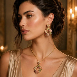 Woman wearing floral earrings and necklace in a warm, indoor setting